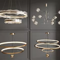 Stylish Modern Chandeliers Featuring Layered Circular Rings Transparent Glass Balls And Metallic Frames