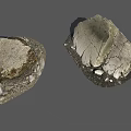 Rough Natural Stone And Wood Pieces With Textured Surfaces And Small Pebbles