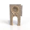 Traditional Stone Architectural Structure With Arched Doorway And Circular Carved Decoration