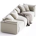 Modern Beige Sectional Sofa With Multiple Plush Pillows And Cozy Gray Blanket In Living Room