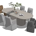 Round Dining Table Set With Various Style Chairs Green Plant And Books