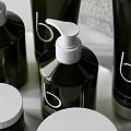 Modern Bathroom Accessories With Green Toiletries Stacked Gray Towels Shaving Brush And Reed Diffuser