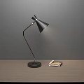 Modern Black Table Lamp With Sleek Design On Wooden Table And Book
