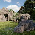 Garden Ornament With Natural Rock Formations Green Grass And Trees Under Blue Sky
