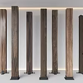 Multiple Wooden Columns Featuring Different Textures And Black Bases In Indoor Setting