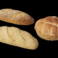Assorted Fresh Bread Varieties Including Sesame Loaf And Round Cross Pattern Loaf
