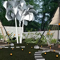 Evening Courtyard Garden With Teepee Structures Palm Trees Stepping Stone Path White Lights And Lush Greenery