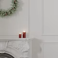 Festively Decorated Christmas Tree With Gifts Candles And Snowy Window View