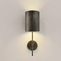 Modern Wall Lamp With Cylindrical Gray Fabric Shade And Metal Arm On Light Wall