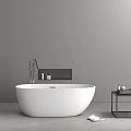 White Freestanding Bathtub In Modern Bathroom With Gray Wall Black Shelf And Side Table