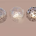 Floral Display Decoration Featuring Three Metallic Hollow Spheres With Intricate Designs