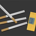 Parisienne Brand Cigarettes With Yellow Box And Filter Tips On Black Surface