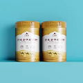 Colostrum Probiotic Camel Milk Powder in Two Golden Cans with Camel Patterns on Light Blue