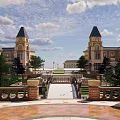 Scenic Landscape With Stone Bridge Water Pool Green Lawns And Historic Buildings Under Blue Sky