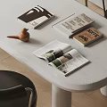 Open Coffee Themed Magazines And Books With Interior Design Pages And Wooden Bird Decor