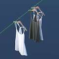 Camisoles In Various Colors On Wooden Hangers Hanging From Green Clothesline