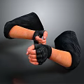 Man With Black Gloves On Arms Showing Fist Gesture Against Gray Background