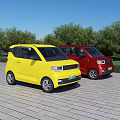 Yellow and Red Small Cars Parked on Brick Pavement With Green Trees