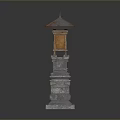 Traditional Stone Lantern With Intricate Stone Base And Wooden Top Structure