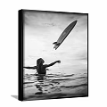 Black and White Person Painting With Surfboard Reaching Up Over Ocean Water