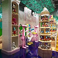 Pink Panther Themed Shopping Mall Store With Castle Shaped Decor Green Walls And Product Shelves
