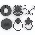 Set of Black Decorative Door Handles With Various Intricate Designs