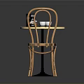 Modern Round Table With White Top And Black Legs Paired With Wooden Curved Back Chairs