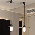 Modern Minimalist Pendant Lights With Black Rods And White Shades In Interior Space