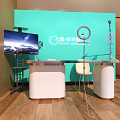 Smart Office Desk With Teal Backdrop Monitor Microphone Ring Light And Chairs