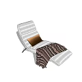 White Lounge Chair With Brown Cushion And Striped Blanket On Black Frame