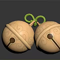 Golden Bells With Curved Patterns Tied By Green Rope On Dark Background