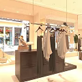 Warm Light Tone Modern Clothing Store With Exquisite Interior Design And Neat Womenswear