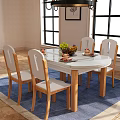 Round Dining Table Set with Six Wooden Chairs White Cushioned and Vase on Blue Rug
