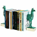 Colorful Books Neatly Arranged With Green Camel Bookends On Shelf