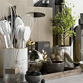 Organized Kitchen Utensils On Wooden Tray With Glass Jars Eggs And Green Plants On Countertop