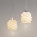 Two White Spiral Shaped Pendant Lights Hanging In Gray Interior Space