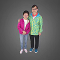 Two People Standing Together in Colorful Jackets Against Gray Background