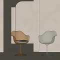 Modern Designer Single Chairs With Golden And Transparent Wine Glass Bases In Minimalist Room