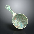 Ancient Bronze Spoon With Ornate Carved Patterns And Curved Handle Design