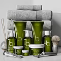 Modern Bathroom Accessories With Green Toiletries Stacked Gray Towels Shaving Brush And Reed Diffuser