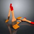 Wooden Paintbrushes With Red Handles And Yellow Bristles On Dark Surface
