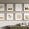 Eight Framed Artworks On Wall With Console Table Vase And Books