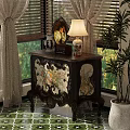 Vintage Dresser with Floral Patterns Dark Wood Frame Vase Lamp by Window and Potted Plant
