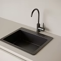 Modern Black Square Sink With Curved Faucet On Light Colored Countertop And Wall