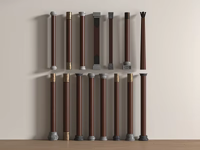 Wooden Columns With Various Designs And Decorative Bases Arranged Against Beige Wall 3d model
