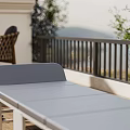 Outdoor Patio Foldable Gray Lounge Chair With Wooden Floor Scenic View And Potted Plants