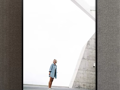 Portrait of a Woman in Light Blue Coat by Modern Gray Wall and White Architecture 3d model