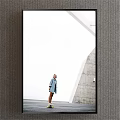 Portrait of a Woman in Light Blue Coat by Modern Gray Wall and White Architecture
