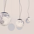 Three Realistic Moon Shaped Pendant Lights Hanging Against Light Background 3d model