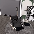 Modern Black Lounge Chair On Wooden Floor With Round Rug Side Table And Portrait
